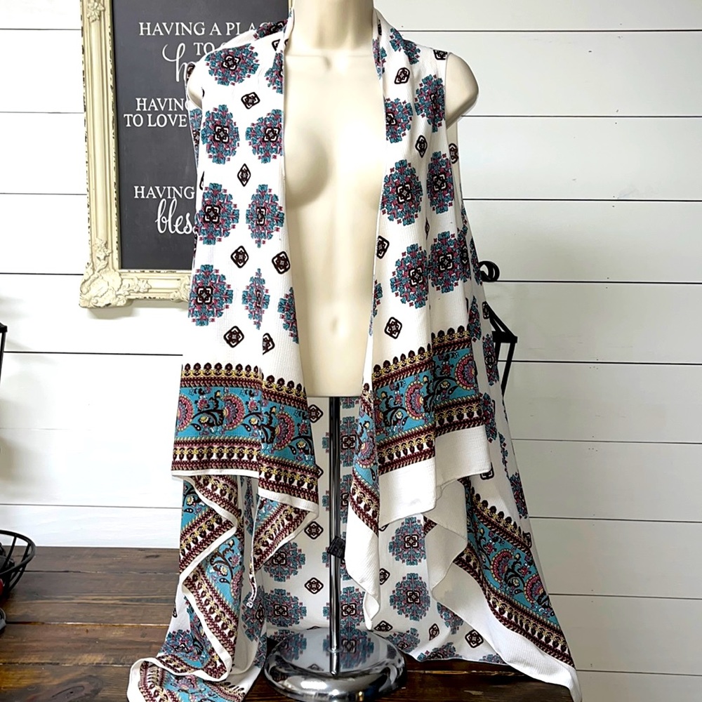 This vest is absolutely beautiful! Made it 100% polyester one size fits most.